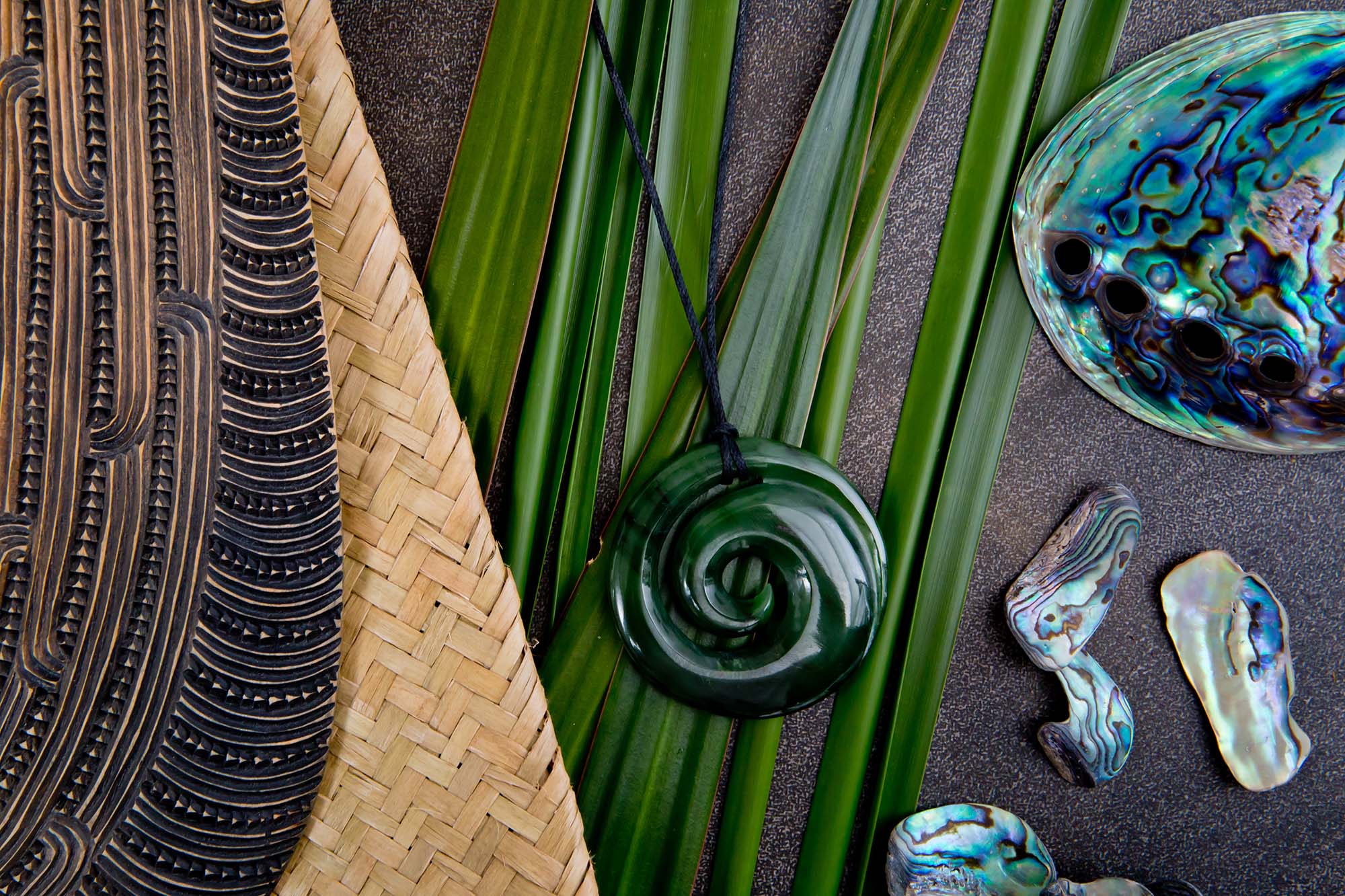 New Zealand - Maori themed objects - mere and greenstone pendant with flax leaves and abalone shells